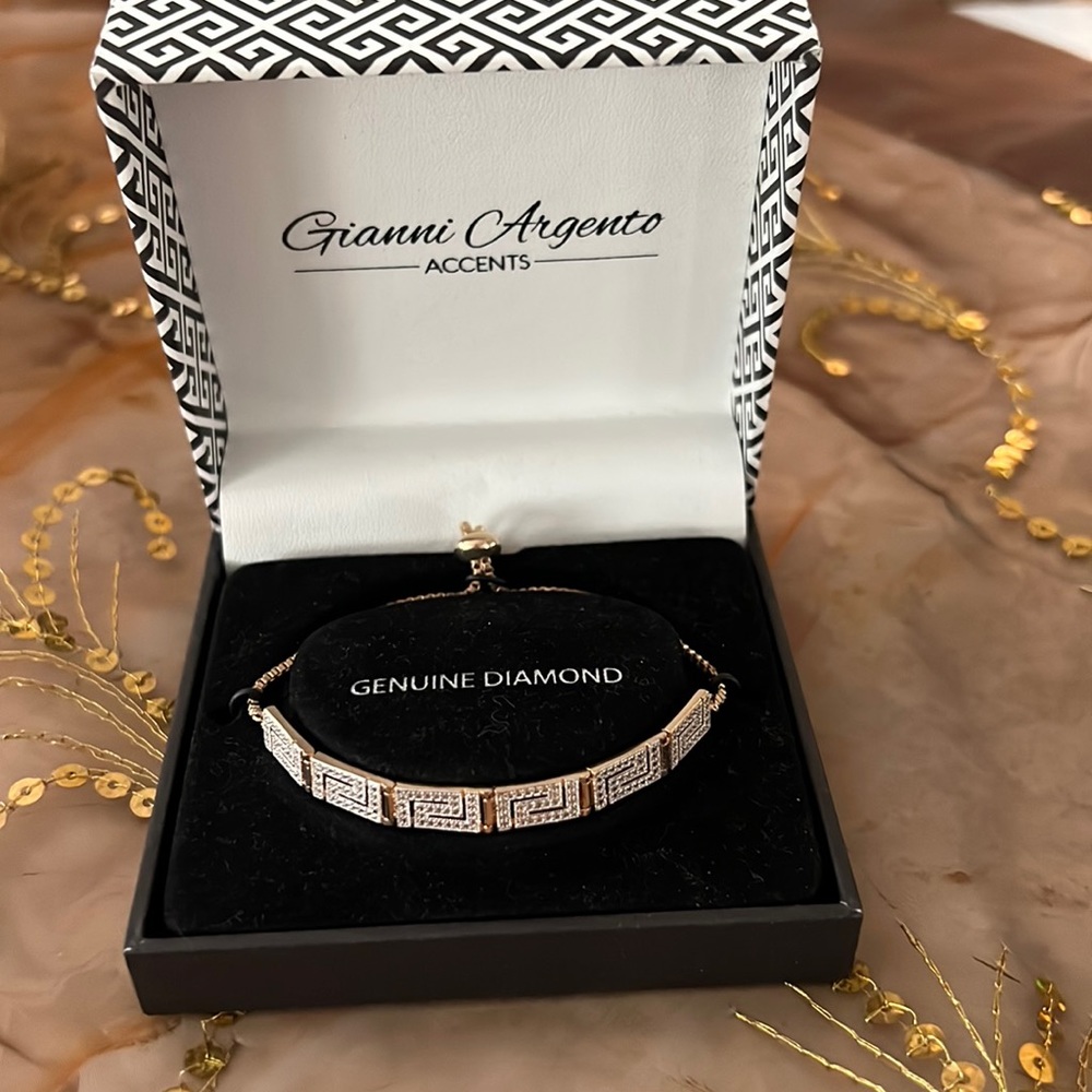 New in box beautiful Greek key gold bracelet adjustable to fit wrist